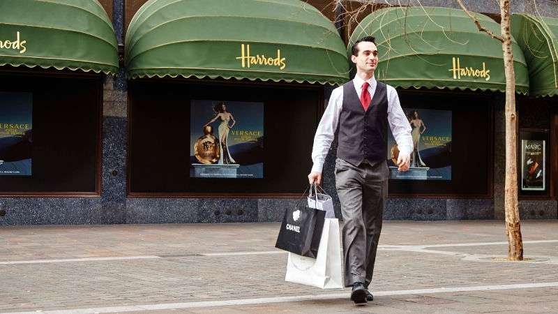 Concierge carrying shopping from Harrods