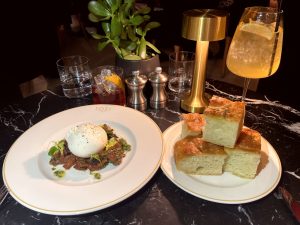 Burrata and rosemary focaccia at Tozi Grande Cafe